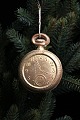 Antique Dresden Christmas ornament from 1900 in the shape of a pocket watch in 
gold painted papier-mâché.