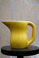 Ursula faience jug in yellow glaze with handle from Royal Copenhagen designed by 
Ursula Munch-Petersen...