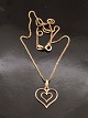 8 carat double 
heart 1.5 x 1.5 
cm. from 
goldsmith 
Herman Siersbøl 
and 8 carat 
gold chain 35.5 
...