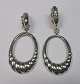 Pair of ear 
clips in 
silver, 20th 
century. 
Length: 6.8 cm. 
Stamped: 
960/1000.