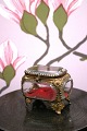 Antique French jewelery box in bronze with faceted glass and silk cushion at the 
bottom...