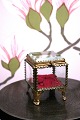 Antique French jewelery box in bronze with faceted glass and silk cushion at the 
bottom...