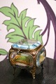 Antique French jewelry box in bronze with faceted glass and silk cushion at the 
bottom...