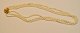 3-row genuine 
cultured pearl 
chain with 
gold-plated 
clasp, 20th 
century. L.: 22 
cm.