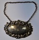 Silver sherry 
sign, 19th 
century. 
England. 
Stamped. With 
chain. 6.5 x 
4.3 cm.