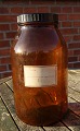 Large and 
well-maintained 
apothecary 
bottle in dark 
brown glass. 
Labeled 
"322722" and 
"Pulvis ...