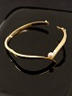 14 carat gold 
bangle with 
real pearl 
inside 6.2 x5.2 
cm. W. 0.4 cm. 
585 SKR for 
goldsmith ...