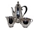 Georg Jensen 
sterling 
silver, rare 
coffeepot, 
creamer and 
sugar bowl with 
grapes.
The coffee ...