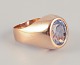 18 karat gold 
ring adorned 
with light blue 
semi-precious 
stones.
Classic 
modernist ...