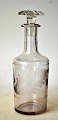 Carafe "Fine 
Champagne", 
circa 1900. 
England. With 
engraved motif 
of oak leaf 
with acorns. 
H.: ...