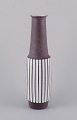 Larholm, 
Norway.
Floor vase 
made of 
ceramic.
Modernist 
design.
Vertical 
lines. White 
glaze, ...
