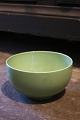 Royal 
Copenhagen 4 
All Seasons 
faience bowl 
with green 
glaze designed 
by Grethe Meyer 
...