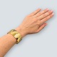 Frantz 
Hingelberg; 
Wide bangle of 
14k gold. 
Inner measure: 
5,8 cm x 5,1 
cm.
Stamped "585 
F.H. ...
