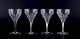 Glimma, Sweden. 
A set of four 
red wine 
glasses in 
crystal, 
faceted bowl 
and stem.
Some with ...