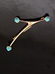 14 carat gold 
modern brooch 
with turquoises 
6 x 1.8 cm. 
stamped 585 
Finnland item 
no. 611734