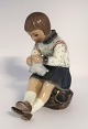 Dahl Jensen. 
Porcelain 
figure. Grethe 
with knitting 
clothes. Model 
1197. Height 
14.5 cm. (1 
sort)