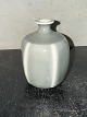 Green glazed 
ceramic vase by 
Mette Harning. 
In good 
condition. 
Signed on the 
bottom. H. 9.6 
cm