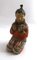 Royal 
Copenhagen. 
Figurine of 
Greenlandic 
girl. Model 
12415. Height 
14.5 cm. (1 
quality)