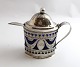 Erik Stridbeck, 
Copenhagen. 
Silver mustard 
jug with blue 
glass. Height 
11 cm. Produced 
1818.