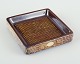 Ingrid 
Atterberg for 
Upsala Ekeby.
Square dish 
made of 
stoneware.
Glaze in brown 
and ...