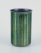 Norwegian 
designer.
Enameled 
copper vase.
Cylindrical 
shape. Glossy 
green and blue 
...