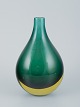 Murano, Italy.
Vase in green 
art glass. 
Chubby shape.
Mouth blown 
with inlaid ...