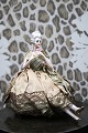 Decorative, old half doll in porcelain from the 1930s with a fine fabric 
dress...