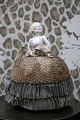 Decorative, old half-doll in porcelain from the 1930s with a fine fabric dress. 
(Pincushion)...