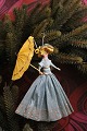 Old Christmas 
tree ornament, 
nice lady with 
umbrella made 
of colored 
crepe paper. H: 
15cm.