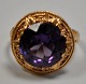 14 carat red 
gold ring with 
brilliant cut 
amethyst, 20th 
century. Size: 
56. Weight: 4.8 
grams. ...