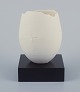 Brigitte Linde, 
Swedish 
ceramicist.
Unique egg of 
white 
porcelain. On 
black wooden 
base.
Late ...