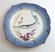 Royal 
Copenhagen. 
Fish set No.19. 
Model 3002. 
Diameter 22.5 
cm. Belone 
acus. Produced 
before ...