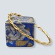 Bangle of 8k 
gold. The 
bangle can be 
opened. 
Oval shape: 6 
x 5 cm.