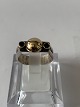 Silver ring with 18 carat gold and 2 green stones.
Size: 54