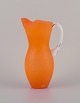 Gunnel Sahlin 
Kosta Boda, 
Sweden.
Large jug of 
art glass.
Orange glass 
with white ...