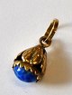 Small 18. Karat 
gold pendant, 
20th century. 
Stamped 18 K. 
With blue 
stone. L.: 2 
cm. Weight: 2 
...