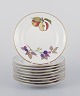 Royal 
Worcester, 
England.
A set of nine 
Evesham 
porcelain 
plates 
decorated with 
fruit and gold 
...