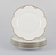 A set of five 
‘Haviland’ 
porcelain 
dinner plates.
Hand-decorated 
gold 
decoration, 
white ...