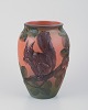 Ipsens, 
Denmark, 
ceramic vase 
with squirrel, 
glaze in orange 
and green 
tones.
Model number 
...