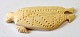Greenlandic 
tupilak made of 
narwhal tooth, 
20th century. 
Decorated as an 
ulu and seal. 
L.: 12 ...