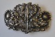 Silver belt 
buckle, 1918. 
Decorated with 
flowers and 
thistles. On 
the back 
engraving: PB 
1918. ...