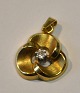 Red gold 
pendant with 
brilliant, 20th 
century 
Denmark. The 
stamp. Weight: 
0.9 grams. 
Dia.: 1.5 ...