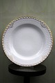 Rare Royal 
Copenhagen deep 
plate in 
Princess with 
gold 
decorations. 
Dia.: 24.5cm. 
Decoration ...