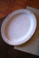 Rare oval Royal 
Copenhagen 
serving dish in 
Princess with 
gold 
decorations. 
41x32.5cm. 
Decoration ...
