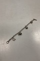 Sterling Silver 
Bracelet by 
Hermann 
Siersbøl with 
Charms
Measures 19cm 
/ 7.48 inch
Weight ...