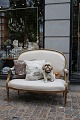 Empire salon 
sofa, gilded 
with a fine old 
patina and 
upholstered in 
light linen. 2 
decorative ...