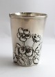 A. Dragsted. 
Small silver 
vase with 
floral motif. 
Height 8.3 cm. 
Produced 1900. 
There are some 
...