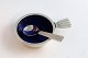 Georg Jensen. 
Bernadotte, 
salt cellar 
with blue 
enamel, and 
salt spoon. 
Sterling (925).