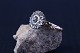 Beautiful and 
unique gold 
ring in 8 carat 
white gold, 
with a 
beautiful 
pattern like a 
flower and ...