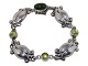 Georg Jensen 
sterling 
silver, 
bracelet with 
green nephrite 
and peridot 
stones.
Design number 
...